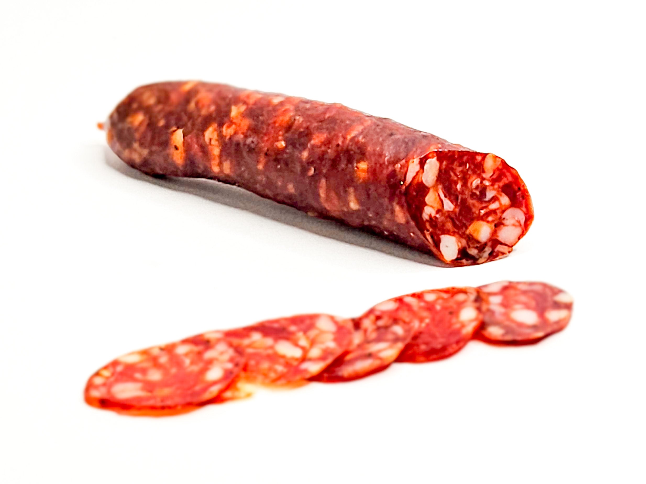 Whole and sliced cacciatore salami